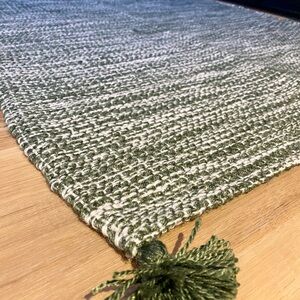 Green and White Woven Rug with Tassels